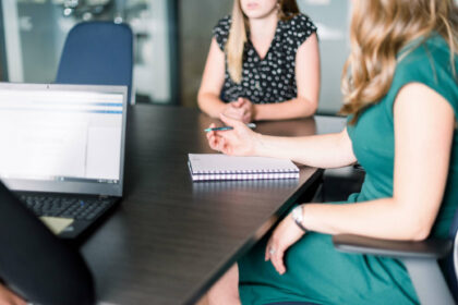 Business women sitting around a conference table